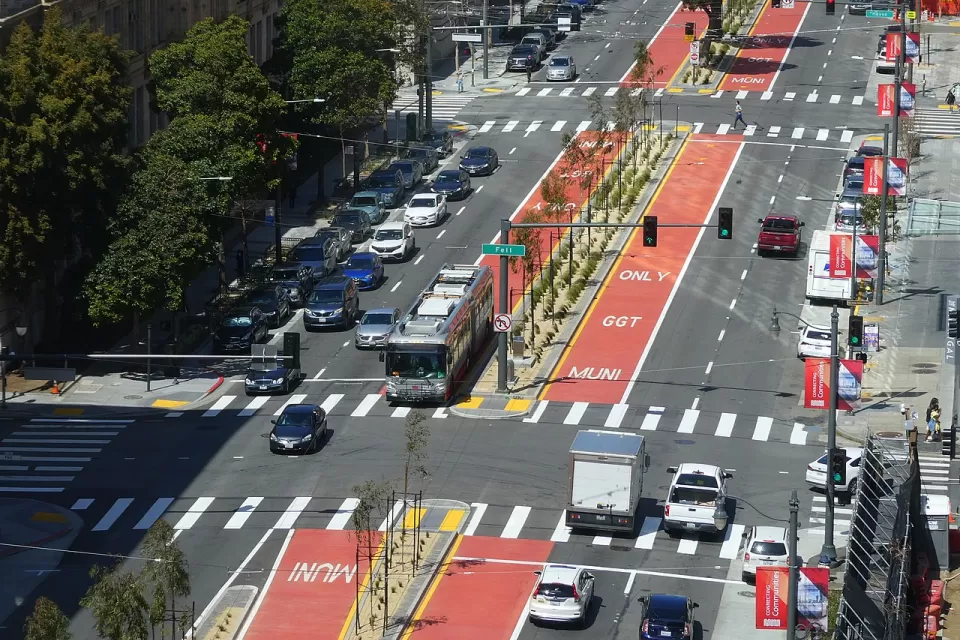 Aerial view of red center bus rapid transit lane with bus on Van Ness Avenue in San Francisco, California